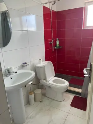 a bathroom with a toilet and a sink at Apartamento T2-Dunas Centro in Tarrafal