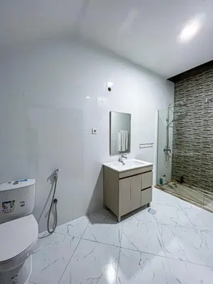 a bathroom with a toilet and a sink and a shower at Figo Apartamentos Cidadela Comfort Flats in Praia