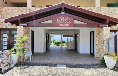 a entrance to a building with a sign that reads prototo antioch como at Beach front ocean view Porto Antigo2 Santa Maria in Santa Maria
