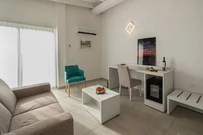 a living room with a couch and a table at Oasis White Hotel in Sal Rei