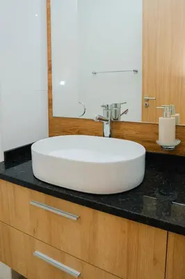 a white sink on a counter in a bathroom at 3 bdr aprt, amazing seaview, rooftop pool - LCGR in Praia