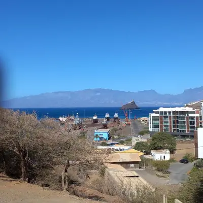 a view of a city with the ocean in the background at Recanto Verde Cara in Mindelo