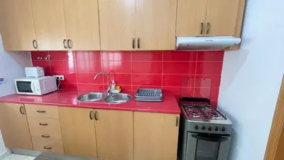 a small kitchen with a sink and a stove at Quick Stay in Praia #2 in Praia