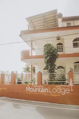 a building with a sign that reads spacio mountain lodge at Strela Mountain Lodge in Tarrafal