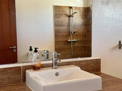 a white sink in a bathroom with a shower at Spacious Penthouse with Sea View - Boteto U in Sal Rei