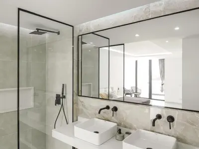 a bathroom with a sink and a mirror at Filomena Apartments LUXURY in Mindelo