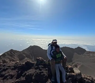 a man and a boy standing on top of a mountain at Casa Ze & sonia in Portela