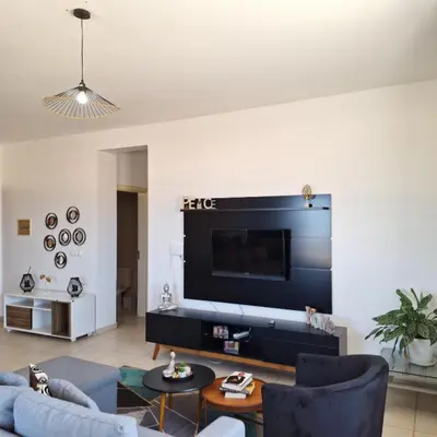 a living room with a large flat screen tv at Ca Luna Deluxe sun & Beach in Sal Rei