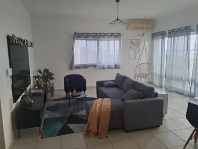 a living room with a couch and a glass table at Ca Luna Deluxe sun & Beach in Sal Rei