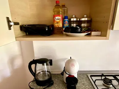 a kitchen counter with a tea pot and a blender at Porto Antigo 2 - By Bobbywashere in Santa Maria