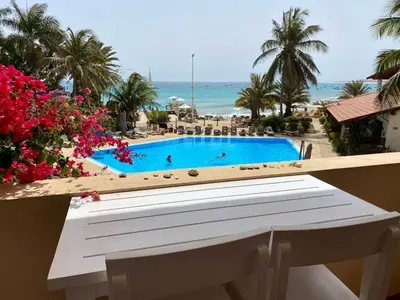 a view of a swimming pool and the ocean at Porto Antigo 2 - By Bobbywashere in Santa Maria