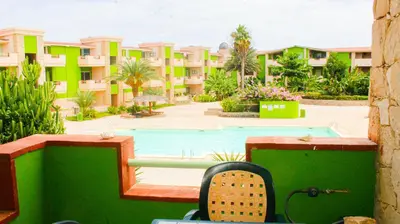 a view from the balcony of a resort with a swimming pool at Djadsal Moradias in Santa Maria