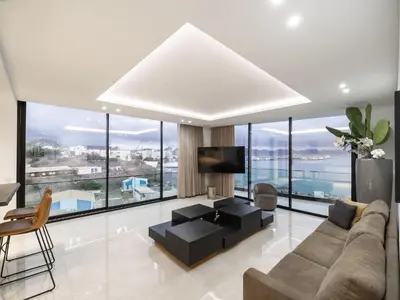 a living room with a couch and a tv at Apartment Sunset in Mindelo