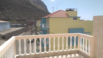 a balcony of a building with surfboards on it at Kolina D´Sol in Ponta do Sol